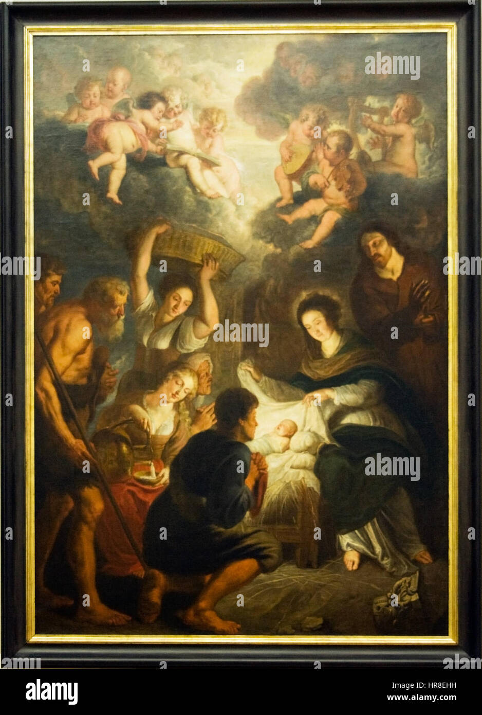 'L'Adoration des bergers' est une scène biblique représentant l'humble visite des bergers au Christ nouveau-né à Bethléem. Ce thème est courant dans l'art chrétien, mettant l'accent sur la naissance divine et la simplicité de la vie précoce du Christ. Banque D'Images