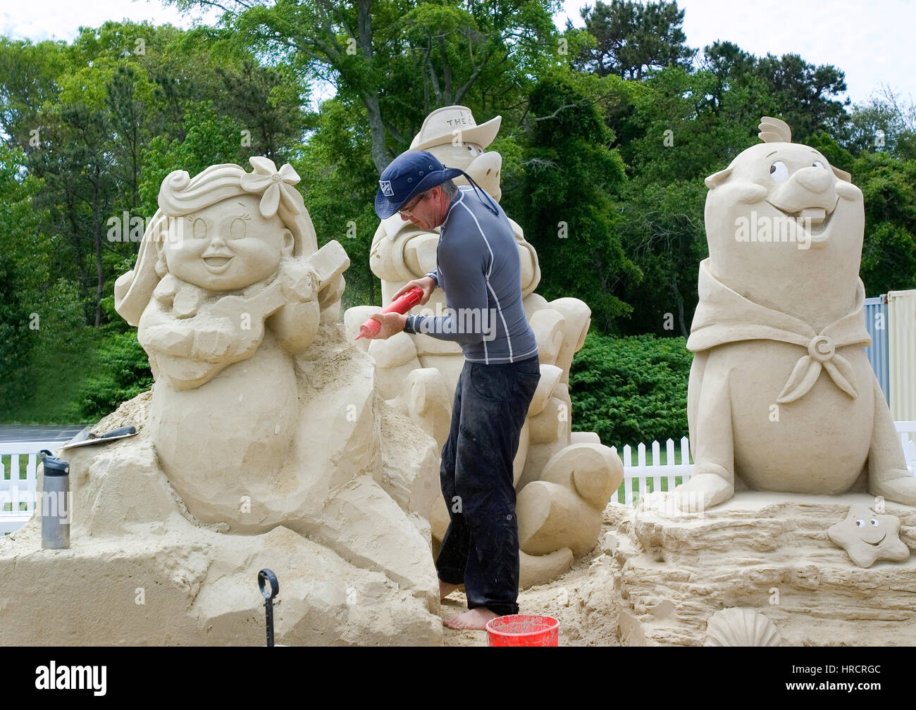 Un artiste au travail de sculptures de sable à Cape Cod Banque D'Images