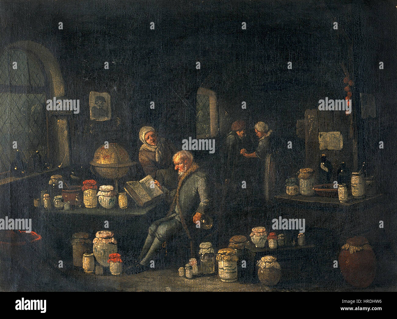 Un vieil homme consultant un livre et tenant un ballon dans un prix w Wellcome V0017151 Banque D'Images