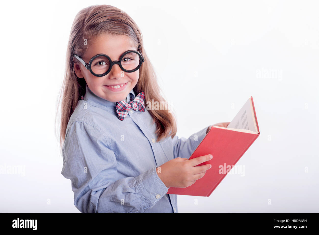 Happy girl avec un livre, le retour à l'école Banque D'Images