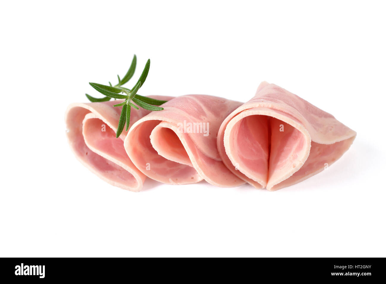 Tranches de saucisse jambon bavarois au romarin sur fond blanc Banque D'Images