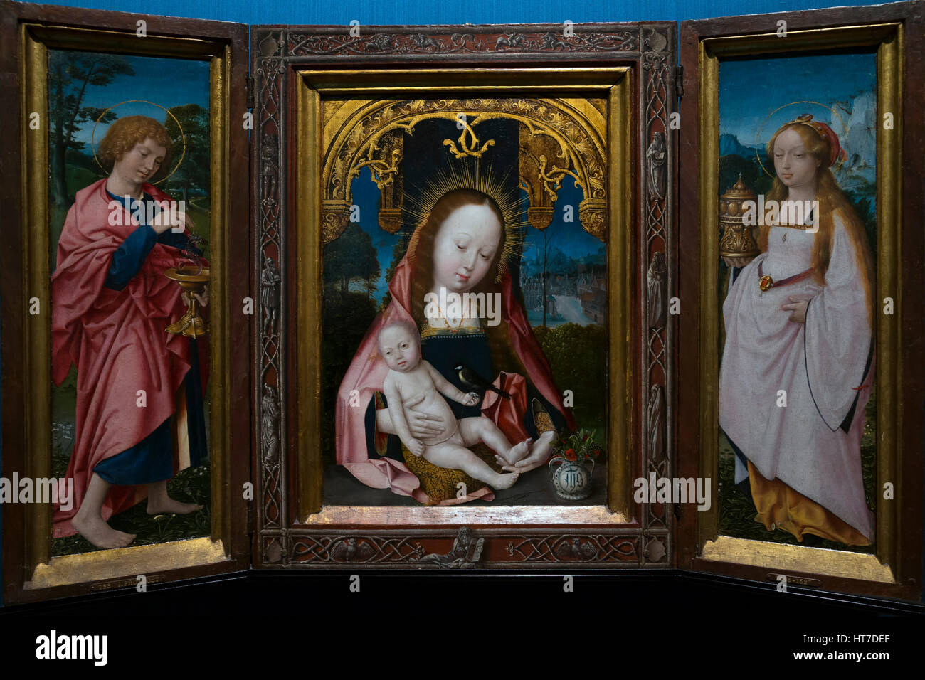Le triptyque avec la Vierge et l'enfant, Jean l'Évangéliste et Marie Madeleine, par Jan Provoost, vers 1520-5, Royal Art Gallery, Musée Mauritshuis, La Haye Banque D'Images
