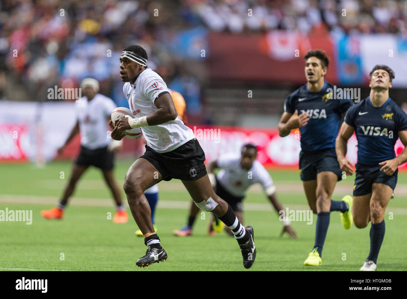 Vancouver, Canada. 11 mars 2017. Kalione Nasoko (3) de Fidji exécutant avec la balle en laissant tout le monde derrière. 1-jour de rugby à VII de la HSBC Canada, BC Place Stadium. © Gerry Rousseau/Alamy Live News Banque D'Images