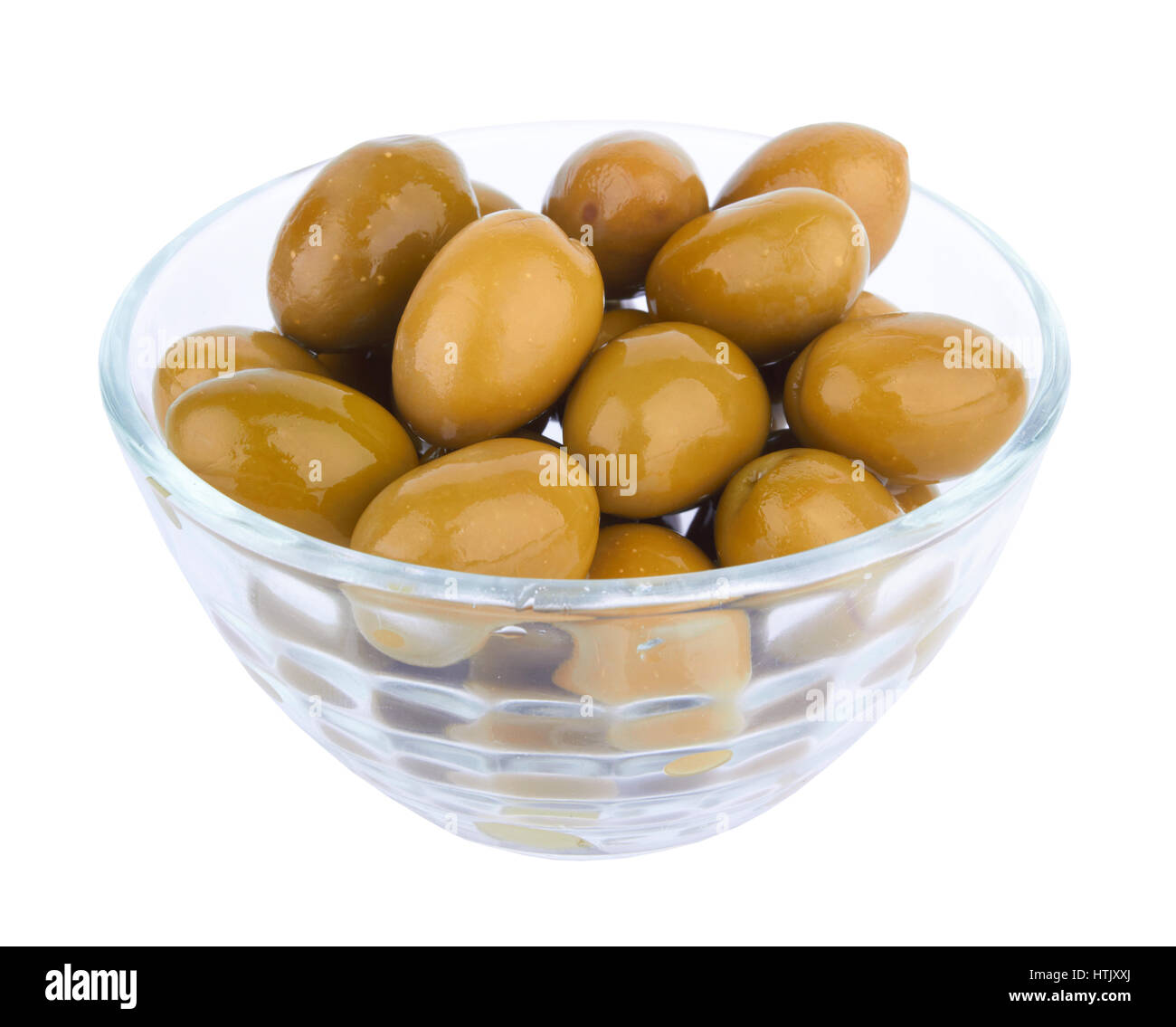 Olives vertes dans bol en verre Banque D'Images