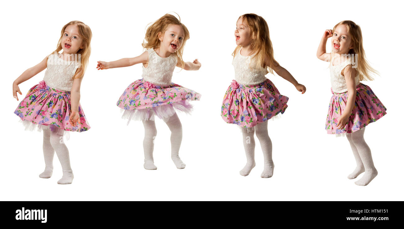 Cute little girl jumping with joy isolé sur fond blanc Banque D'Images