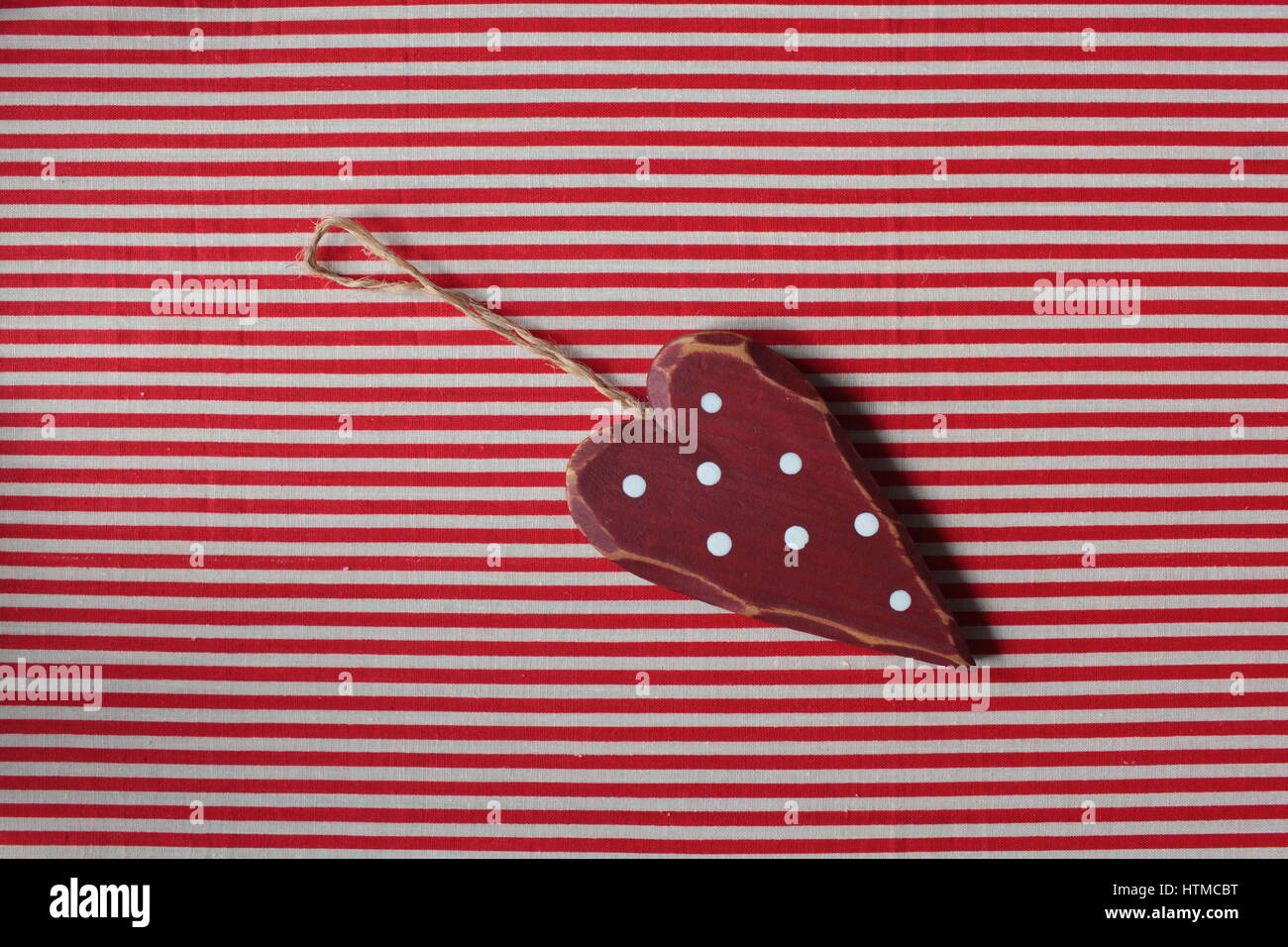 En forme de coeur rouge hochet Banque D'Images
