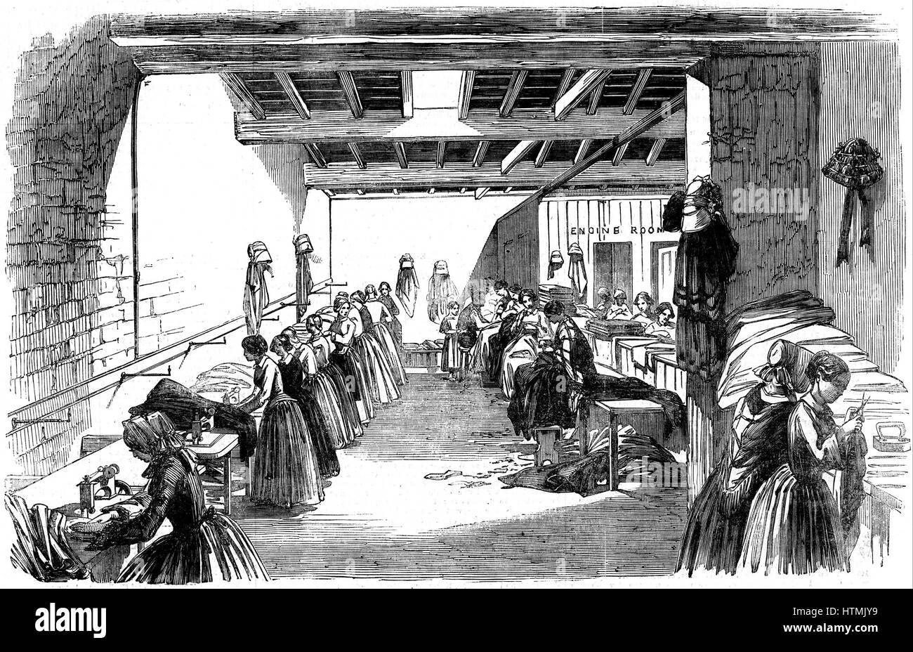 Machine à coudre à vapeur conçu par C.T. Judkin de Manchester en usage à Holloway & Co.'s clothing factory, Stroud, Gloucestershire. Holloways introduit la division du travail dans leur usine. Une paire de pantalons, adopté par 16 paires de mains, chaque Banque D'Images
