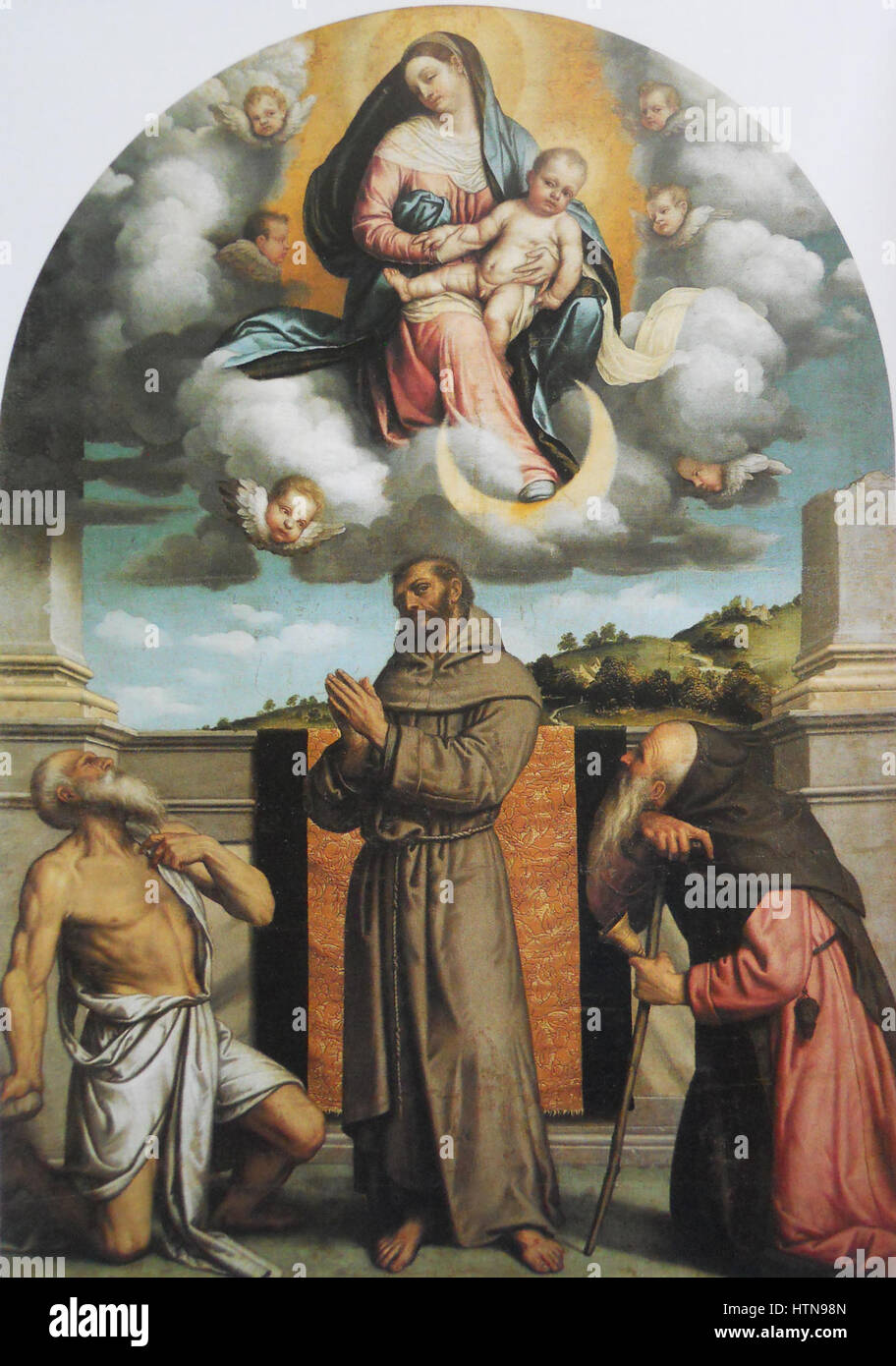 Madonna col bambino dans gloria con i santi Girolamo, Francesco d'Assisi e Antonio Abate Banque D'Images