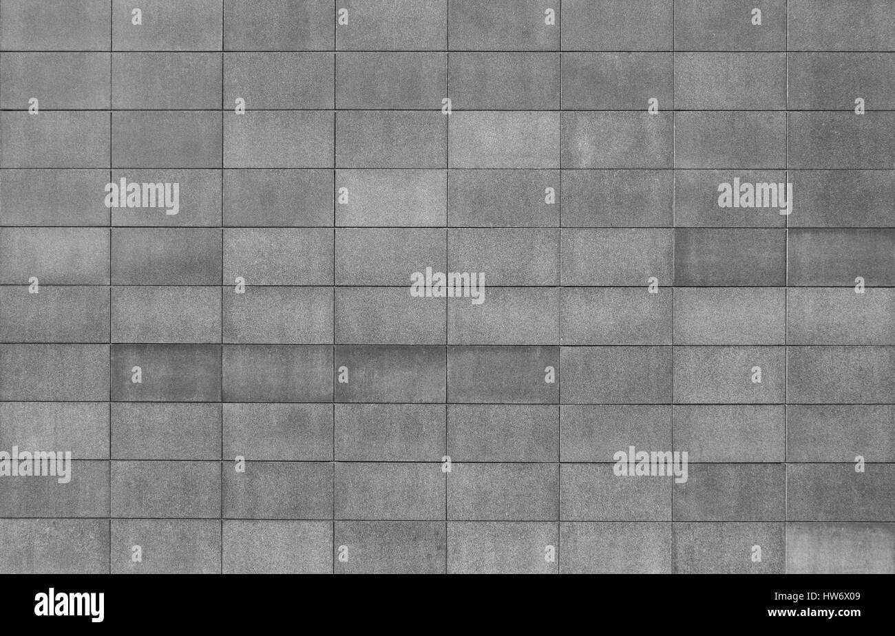 La texture du mur de bloc gris avec différentes nuances de gris. Banque D'Images