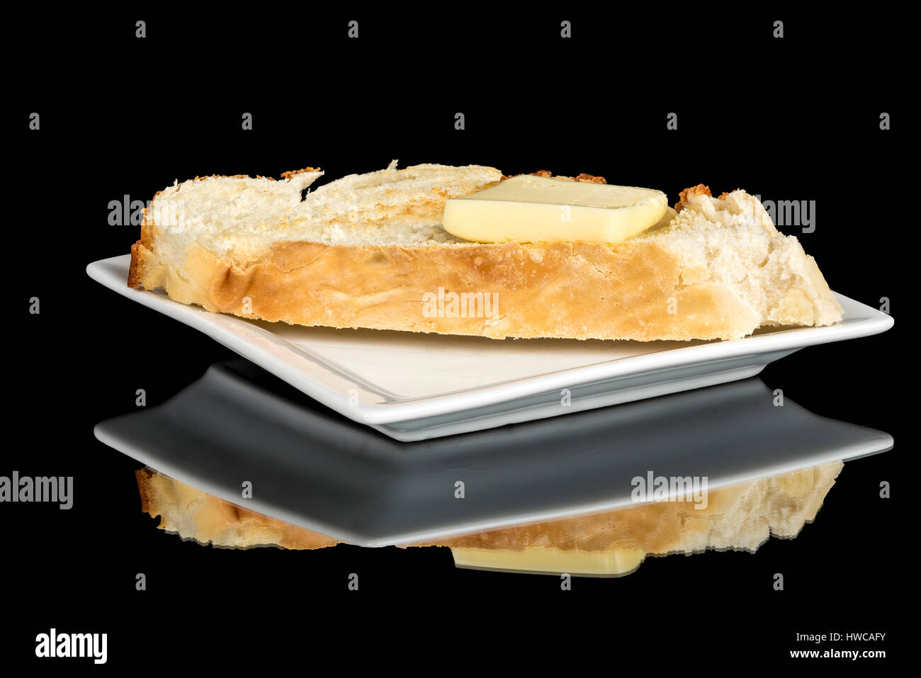Toast avec du pain frais a une noisette de beurre sur elle Banque D'Images