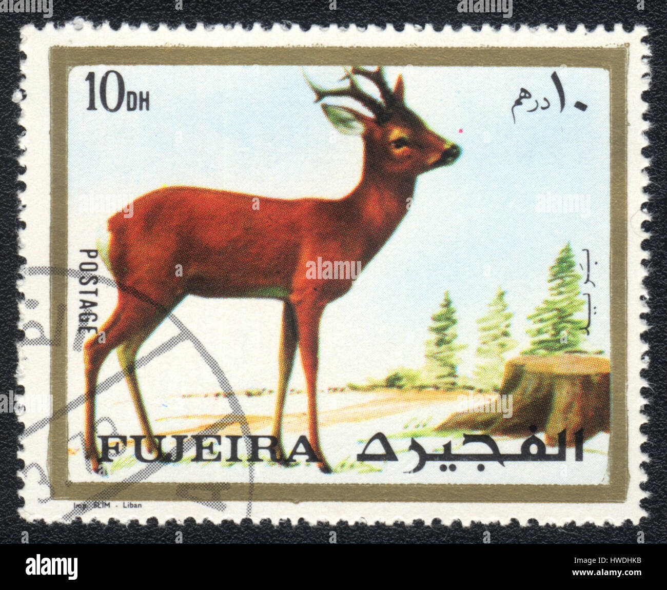 Un timbre-poste imprimé en Fujairah et montre un chevreuil , vers 1973 Banque D'Images