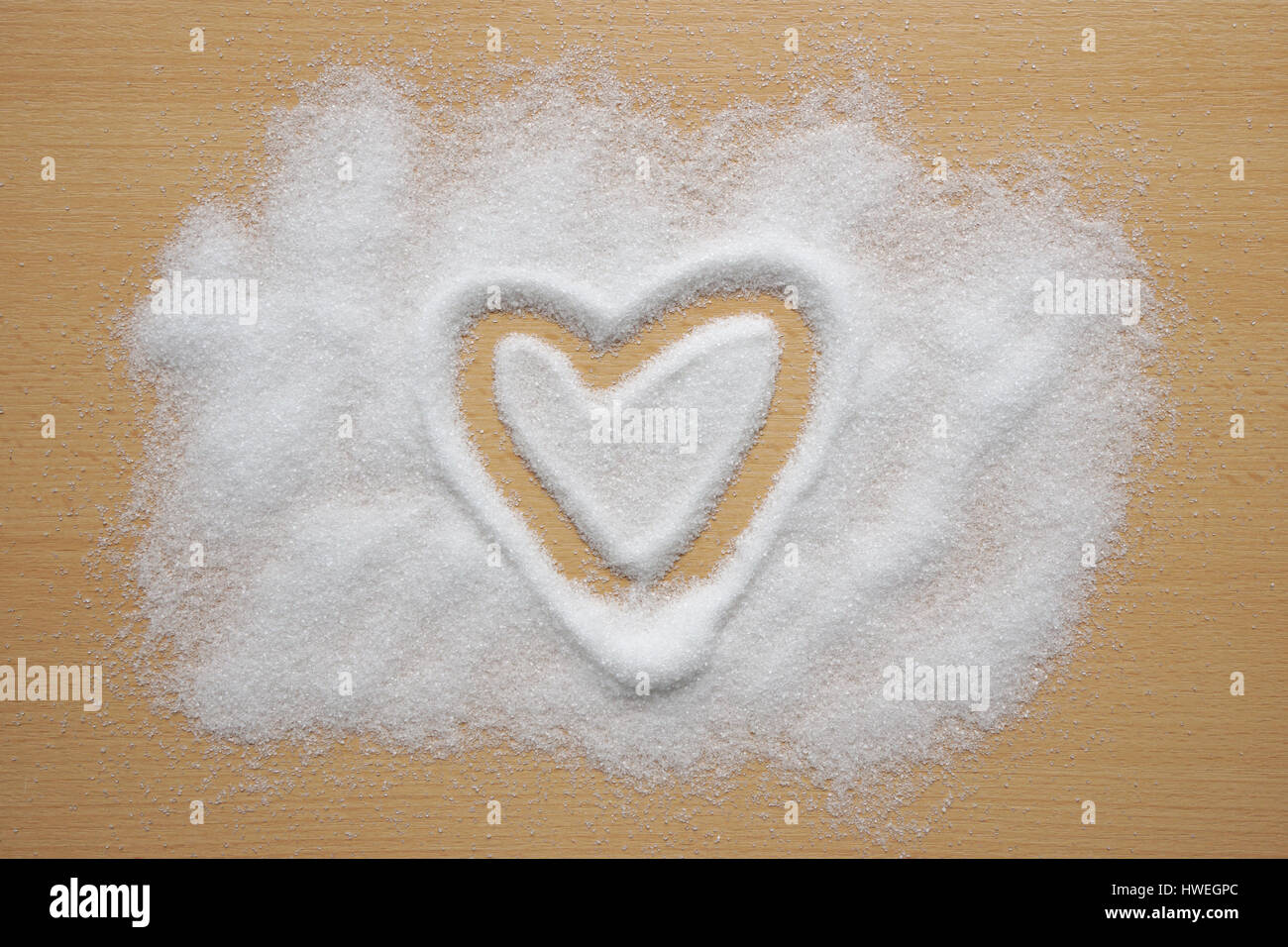 Forme de coeur dessiné dans le sucre Banque D'Images