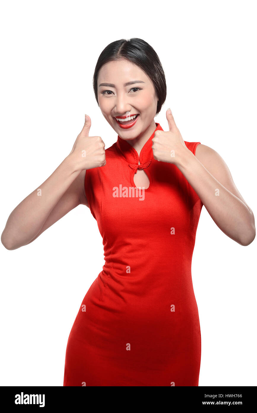 Femme en robe cheongsam chinois show Thumbs up. Joyeux Nouvel An chinois concept Banque D'Images