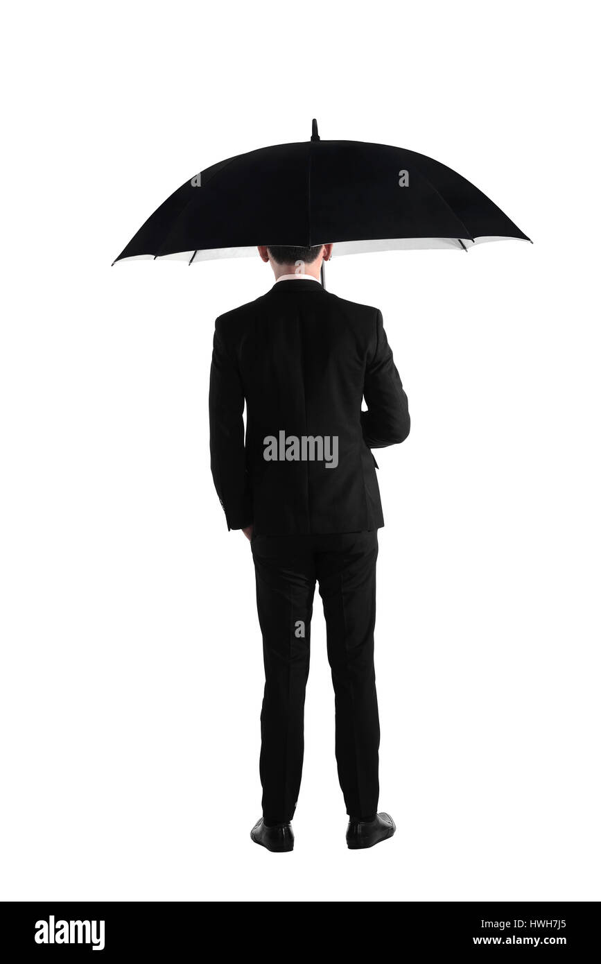 Vue arrière business man standing holding umbrella isolé sur fond blanc Banque D'Images