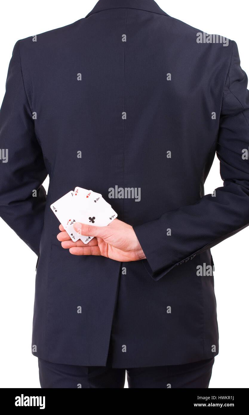 Businessman holding cartes à jouer derrière son dos. Banque D'Images