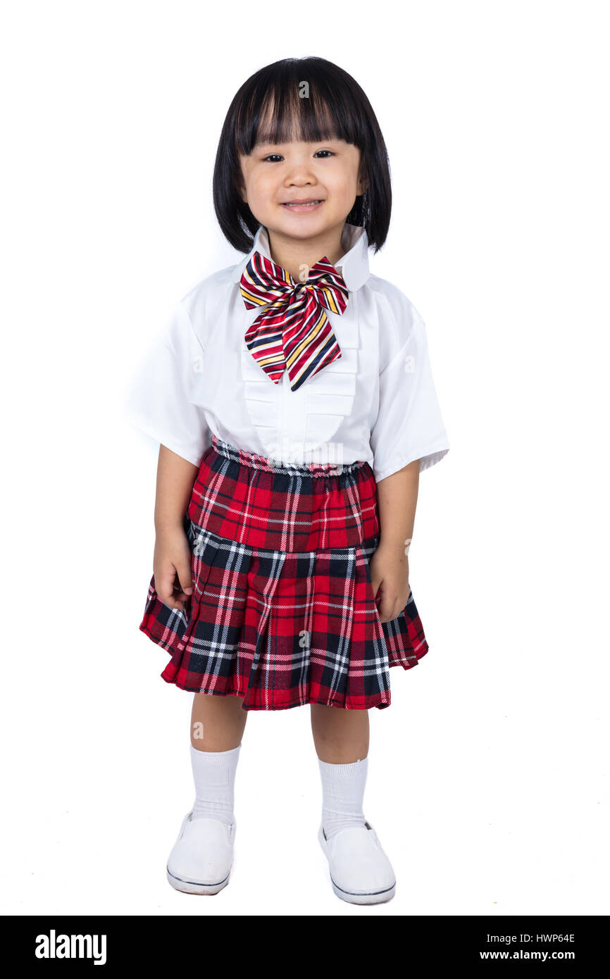 Chinois asiatique petite fille portant des uniformes des étudiants dans les  régions isolées sur fond blanc Photo Stock - Alamy