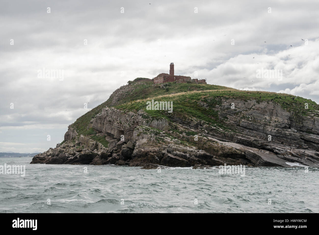 Ruines du monastère sur l'île de macareux, Beaumaris Banque D'Images
