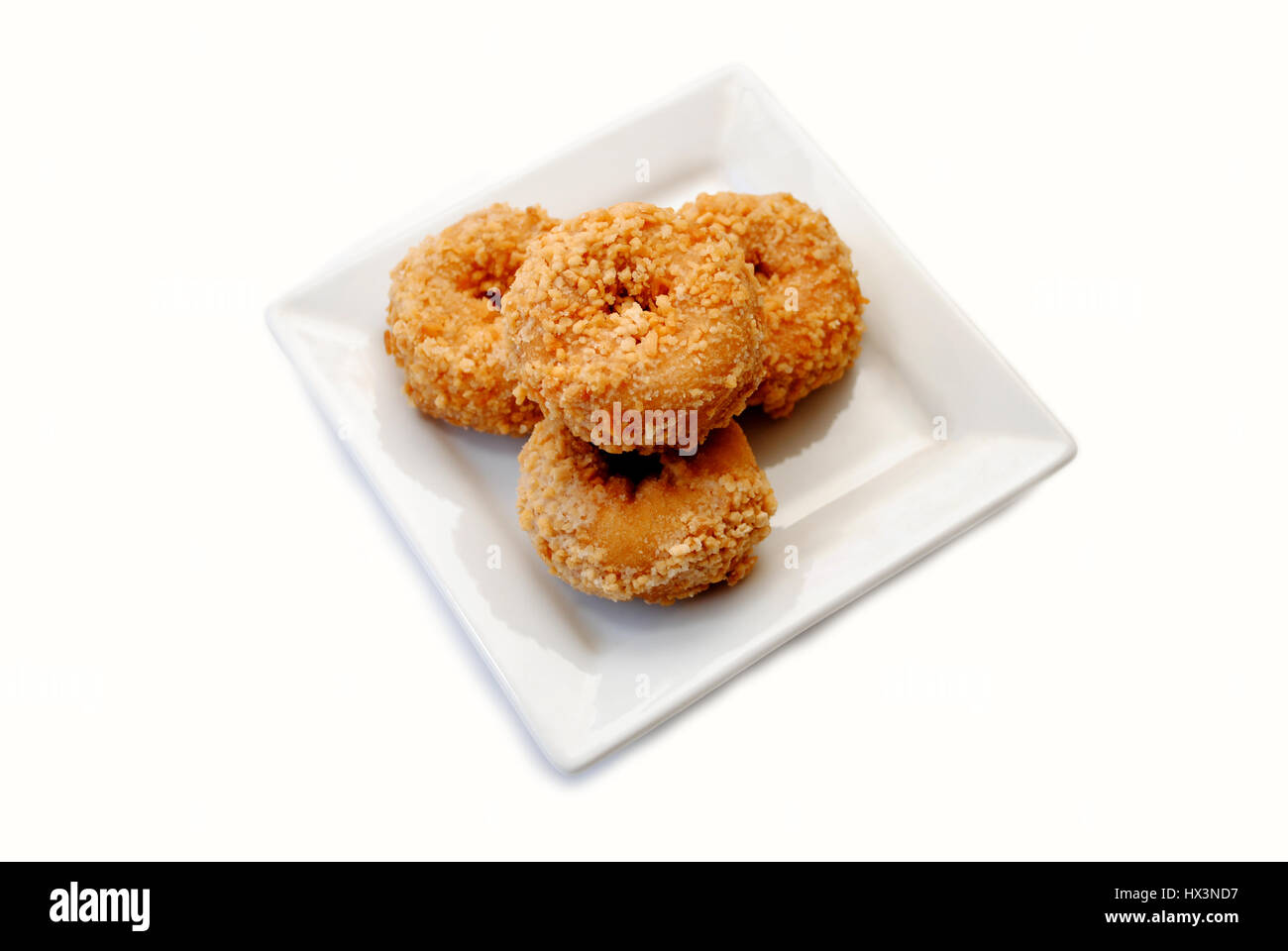 Mini Crunch Donuts sur une plaque blanche Banque D'Images