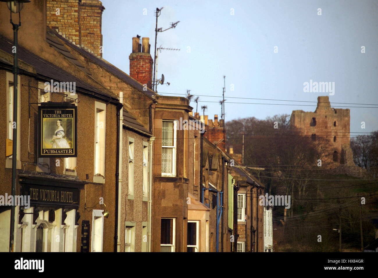 Le Château de Norham et village Banque D'Images