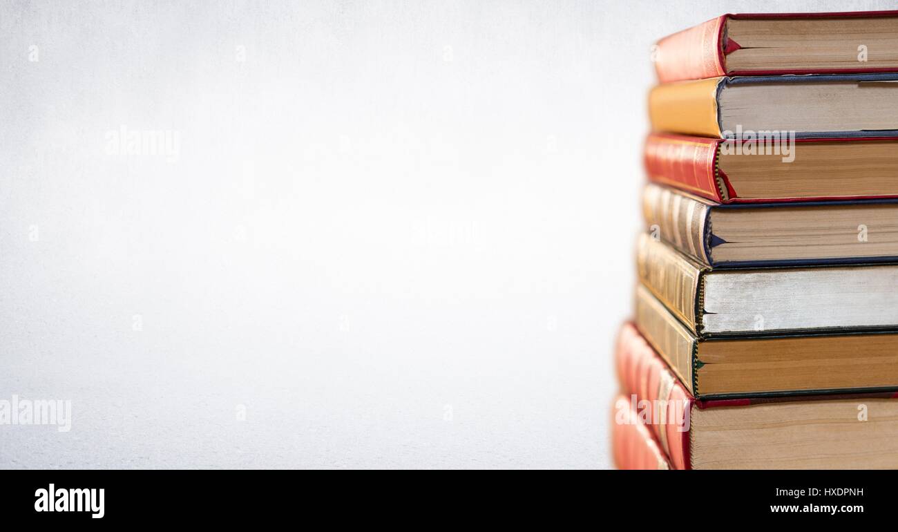 Digital composite of Pile of books against white background Banque D'Images
