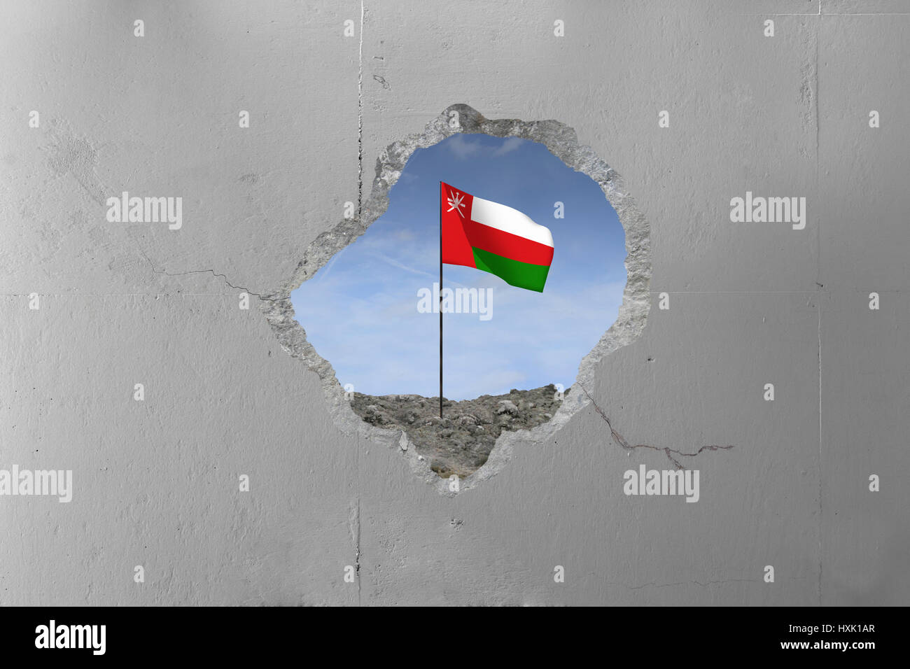 Drapeau Oman derrière un mur de béton. Banque D'Images