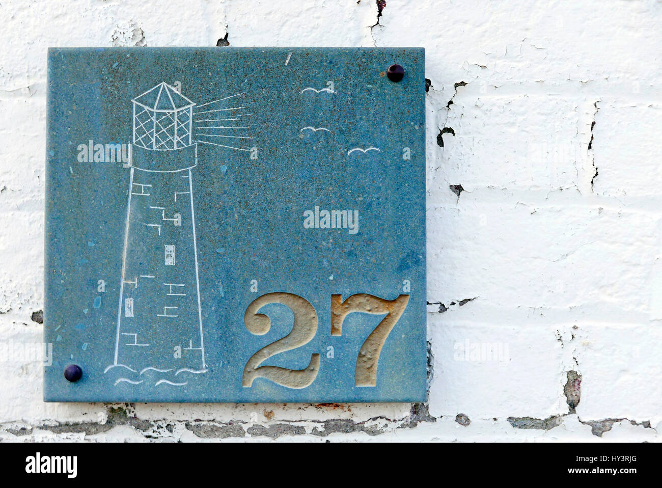 Leuchtturm gravé sur la plaque de granit sur le mur de la maison au numéro 27 Banque D'Images