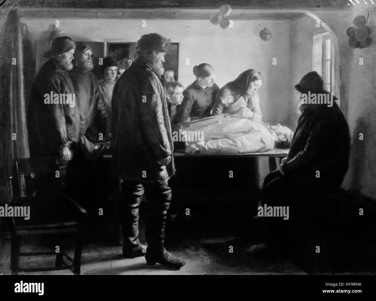 'Den druknede' (l'homme noyé) est une peinture de l'artiste danois Michael Ancher. Il représente une scène dramatique d'un pêcheur sauvé après la noyade, mettant en évidence les luttes de la vie en mer et le lien humain avec l'environnement difficile. Banque D'Images