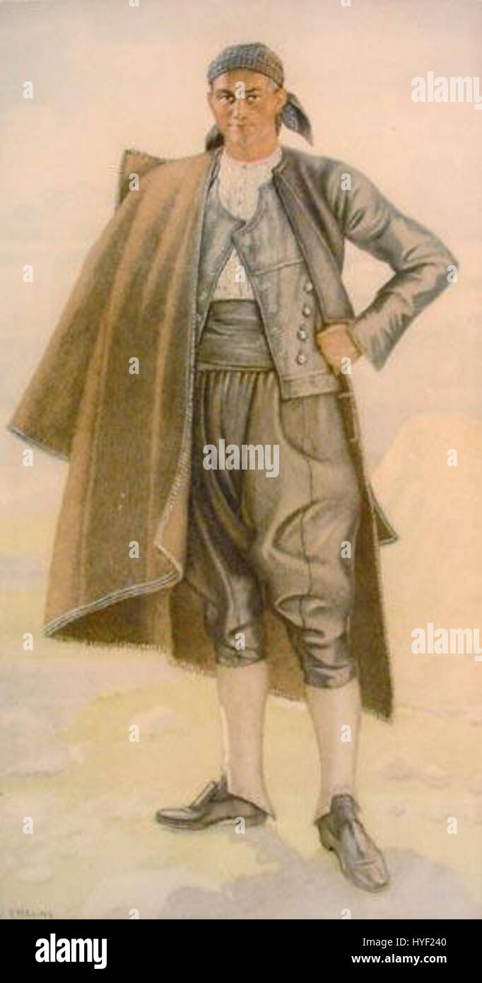 Le *Vraka Lefkas* fait référence aux vêtements traditionnels grecs, en particulier de la région de Lefkada. Le costume comprend généralement un pantalon distinctif (vraka), une chemise blanche et des écharpes décoratives, représentant le patrimoine culturel grec. Banque D'Images