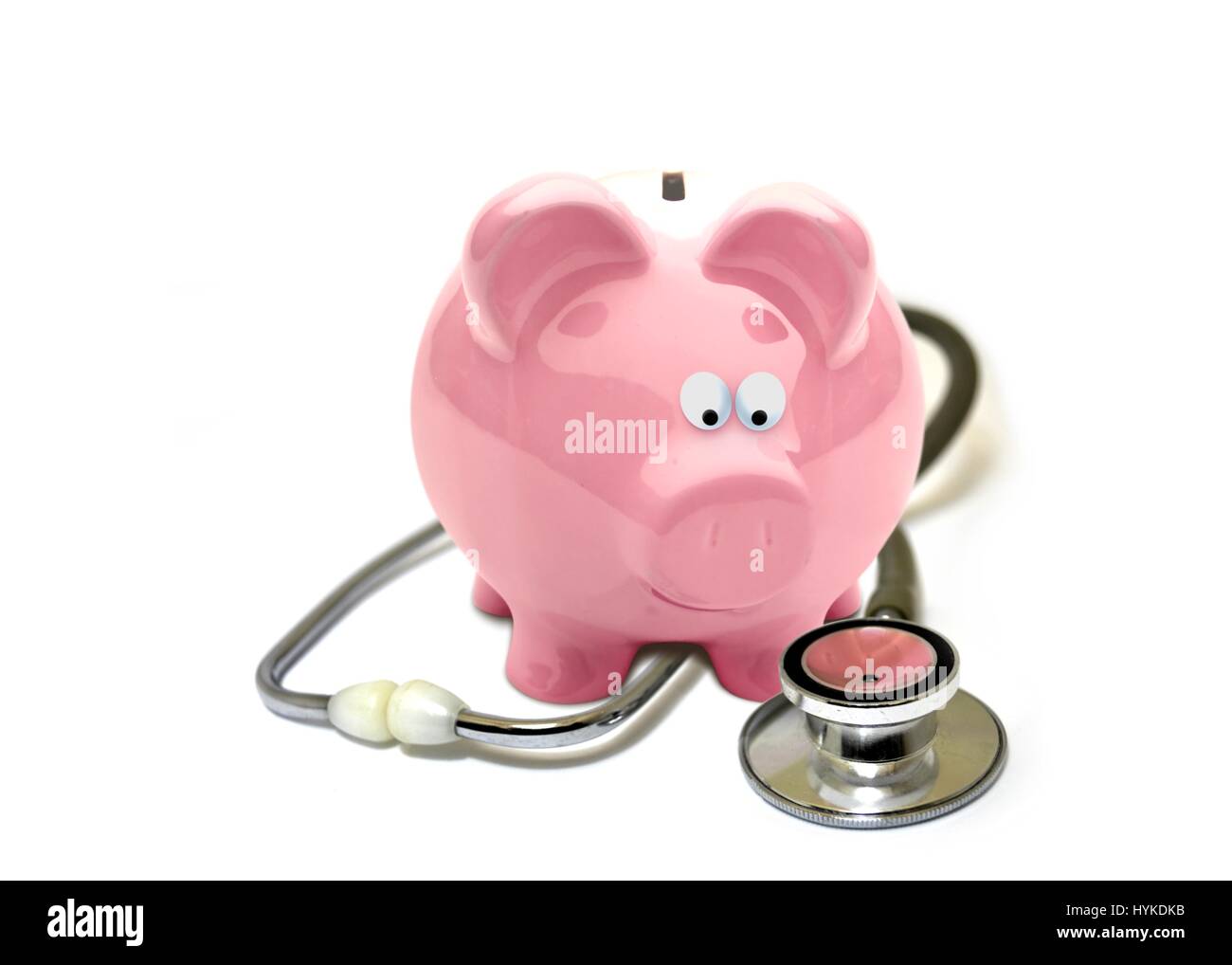 Piggy Bank and stethoscope on white Banque D'Images