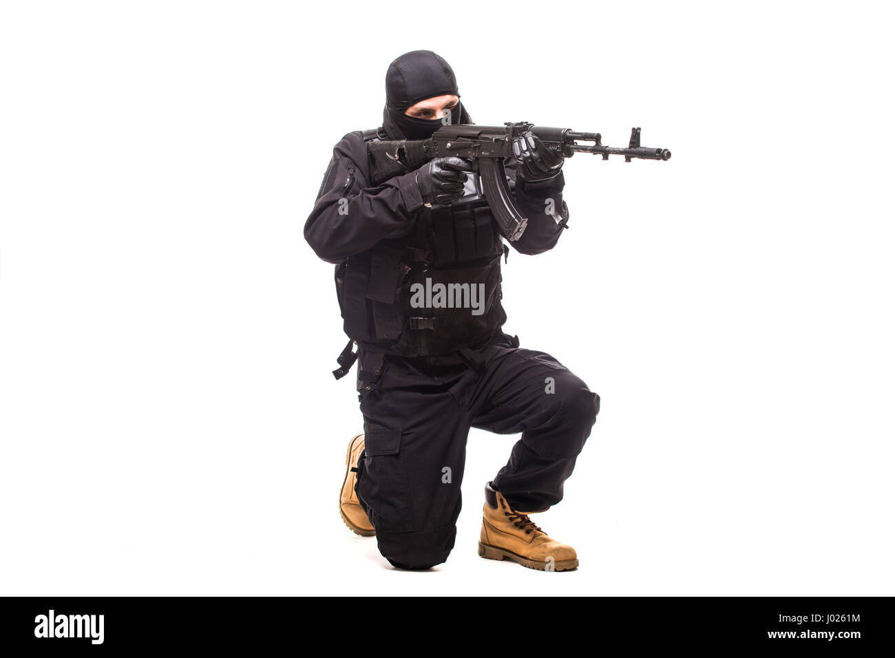 Avec terroristes machine gun sur fond blanc Banque D'Images