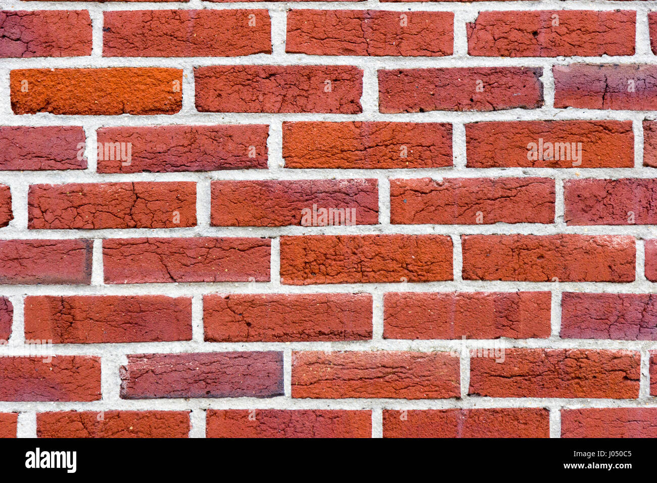 Briques rouges en couches comme revêtement d'un mur Banque D'Images
