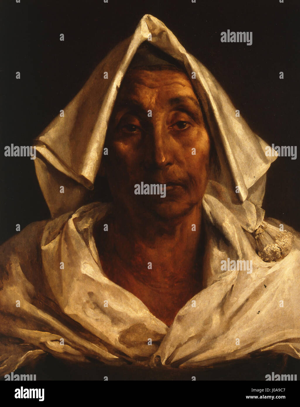 'La vieille femme italienne' de Théodore Géricault est un portrait qui capture la force et le caractère d'une femme italienne âgée. La peinture met en valeur le rendu détaillé des traits du visage et l'expression de l'âge, caractéristique du style de Géricault. Banque D'Images