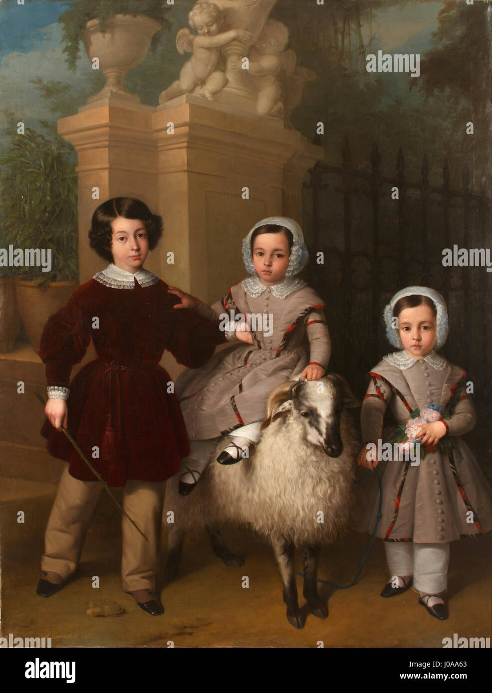 Cette peinture d’Antonio Mª Esquivel, intitulée « enfants jouant avec un bélier », illustre une scène ludique avec des enfants interagissant avec un bélier, démontrant l’habileté de l’artiste à capturer l’innocence et le lien entre les humains et les animaux dans un cadre naturel. Banque D'Images