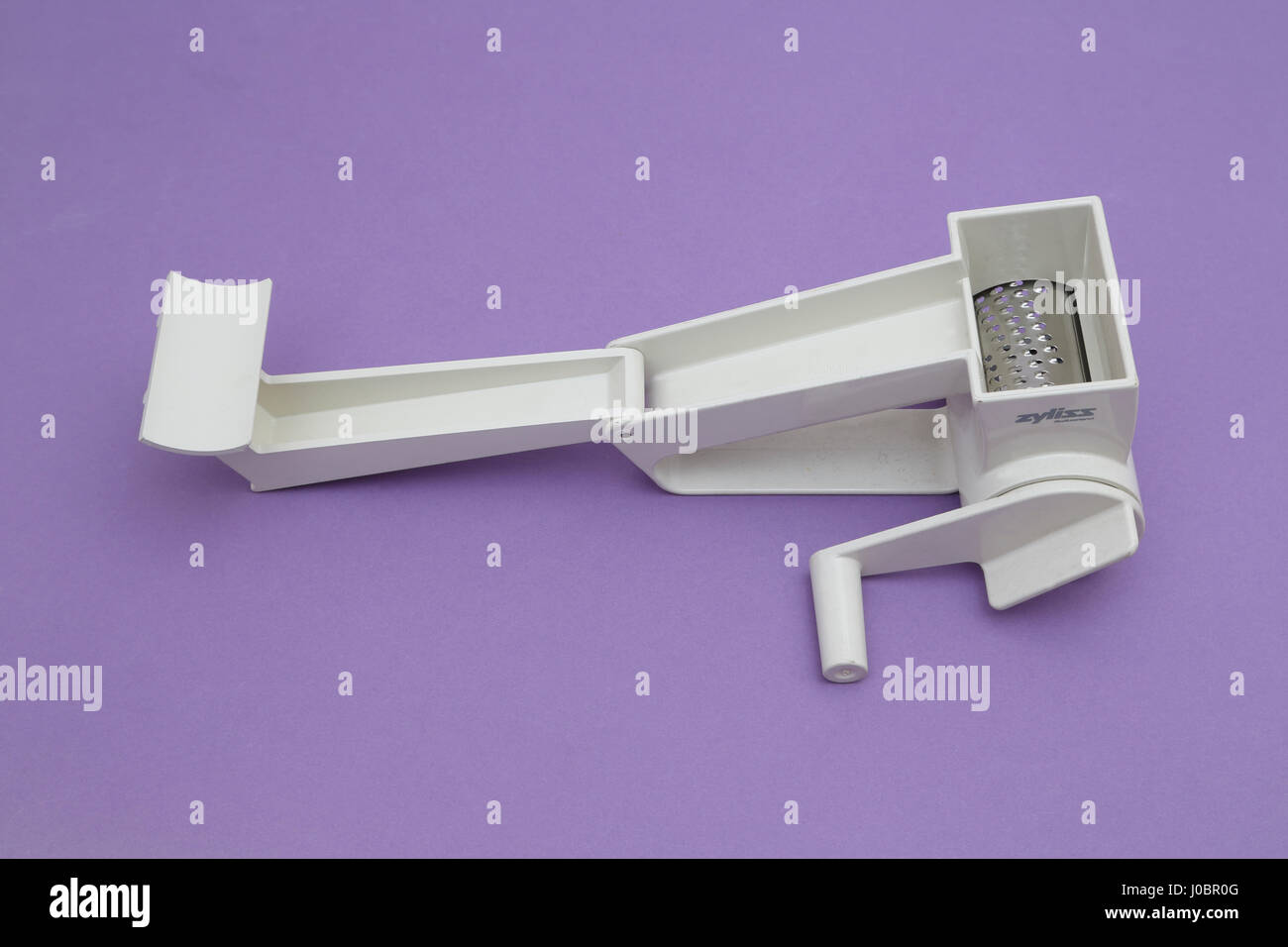 Râpe à fromage Zyliss en plastique avec poignée rotative Banque D'Images