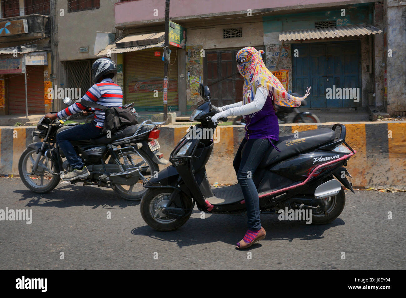 Girls riding sales scooty