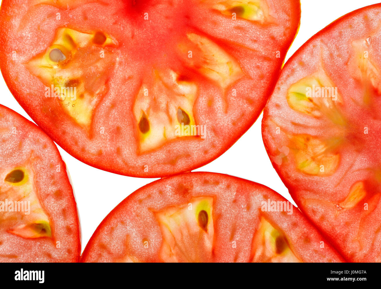 Les tranches de tomate à partir de détails ci-dessus. Close up, full frame tirer. Banque D'Images