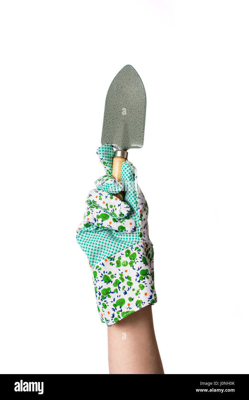 Main dans jardin outil de jardinage holding gants de travail Banque D'Images