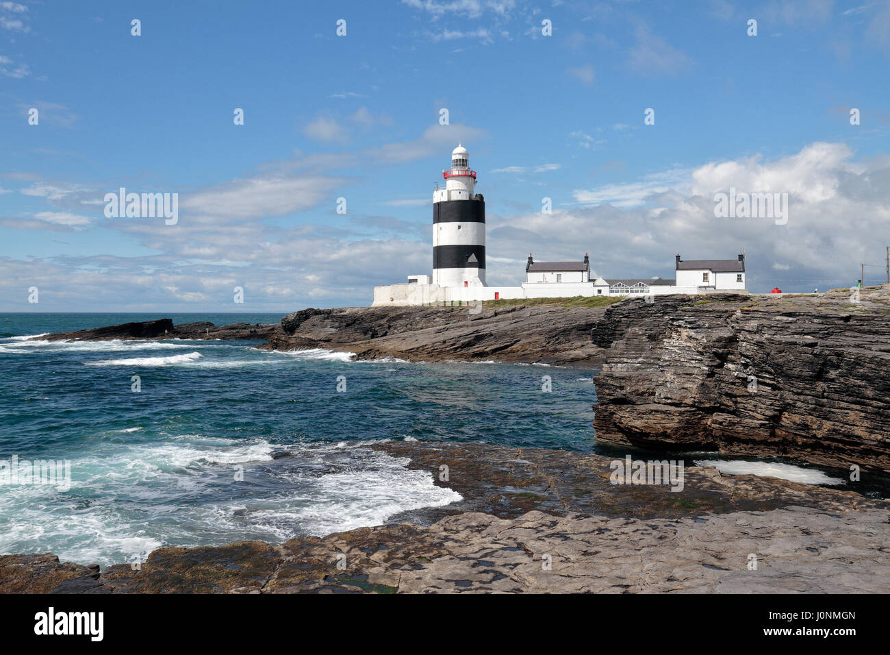 Le crochet phare sur la péninsule de Hook, Co Wexford, Irlande. Banque D'Images