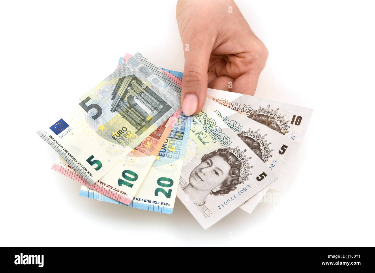 Main tenant l'argent notes, le ventilateur à l'euro et la livre sterling Banque D'Images