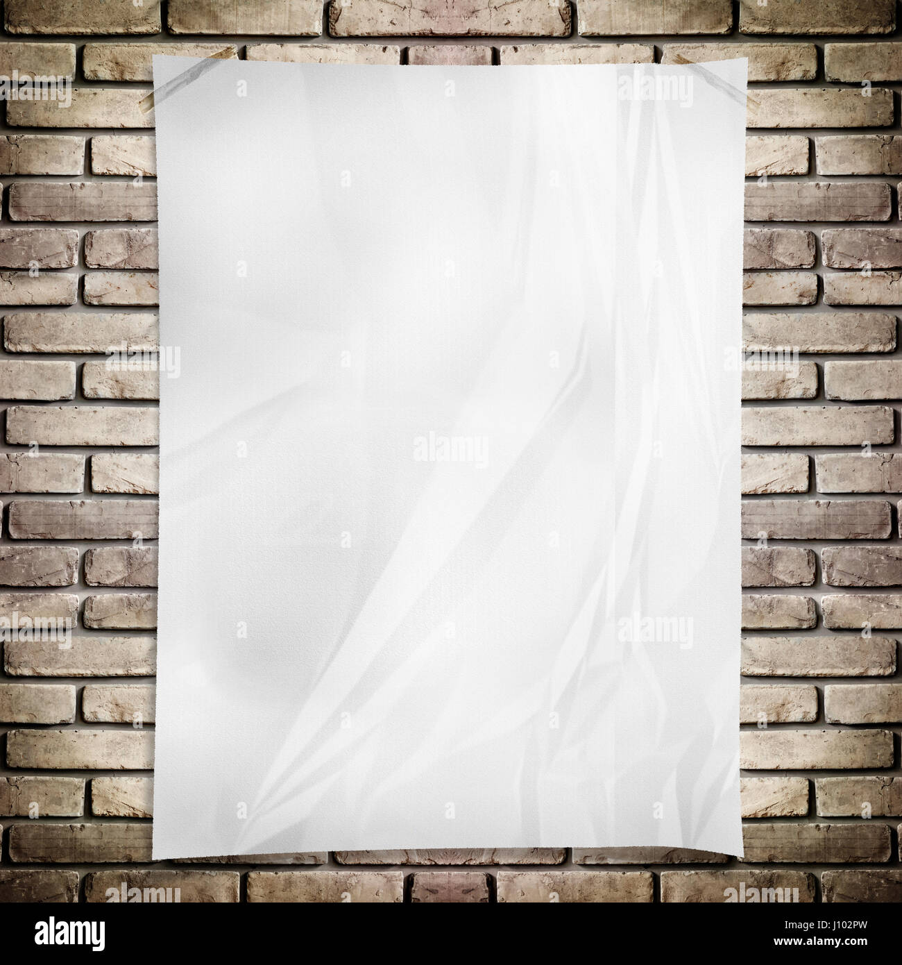 Blank poster accroché sur grunge mur de brique Banque D'Images