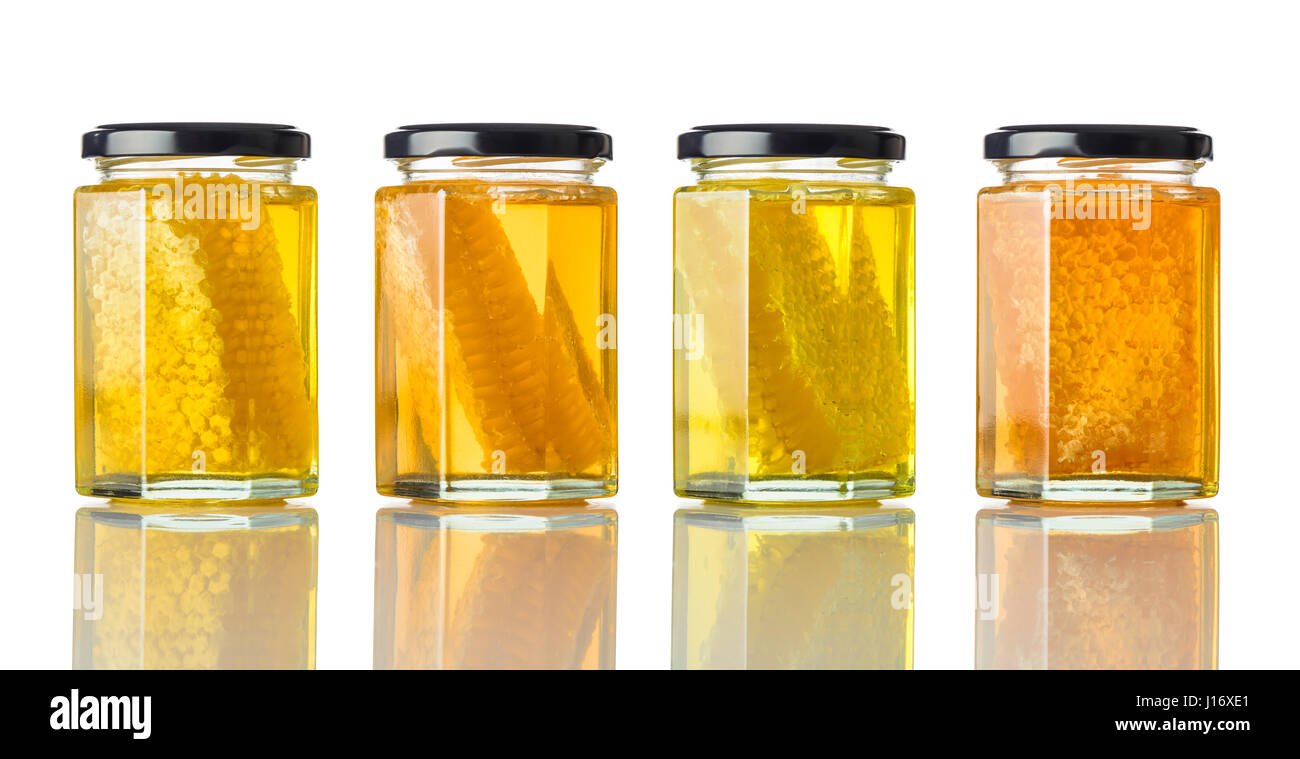 Différents types de miel avec Honeycomb et isolé sur fond blanc Banque D'Images