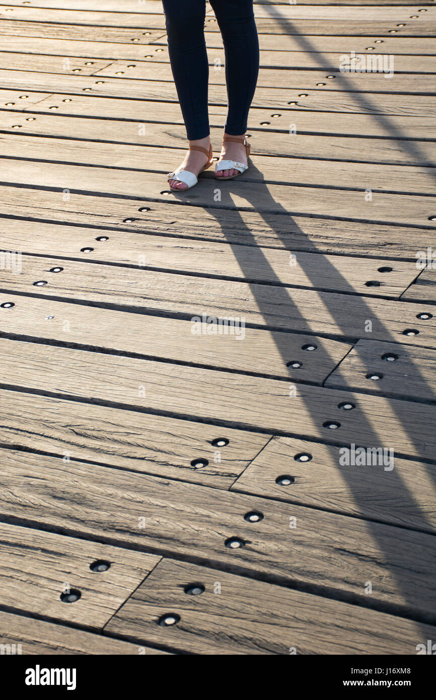 Close up of a woman standing on the pier Banque D'Images