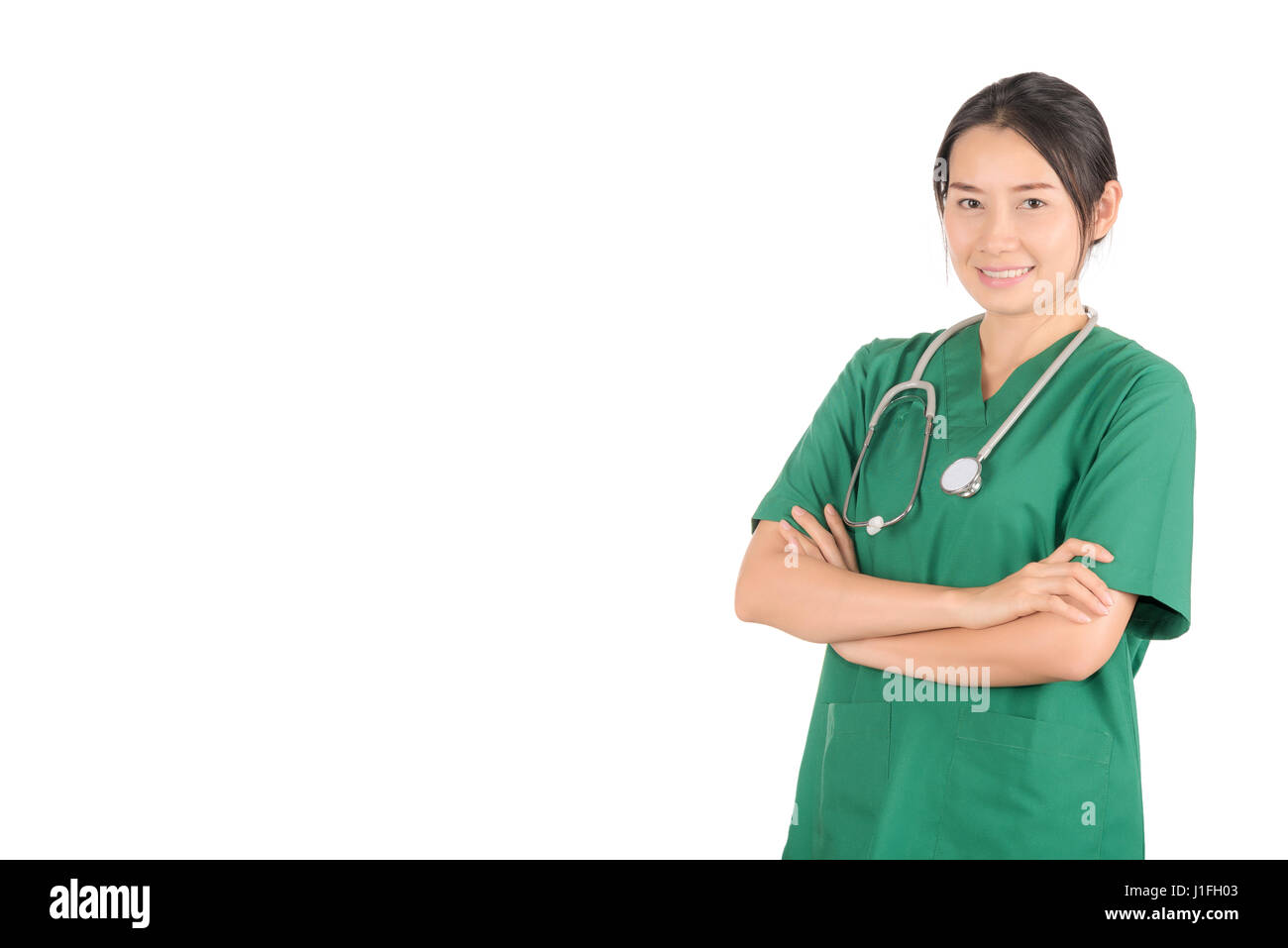 Portrait femme médecin portant un stéthoscope et gommages vert isolé sur fond blanc, secteur médical et de la santé concept Banque D'Images
