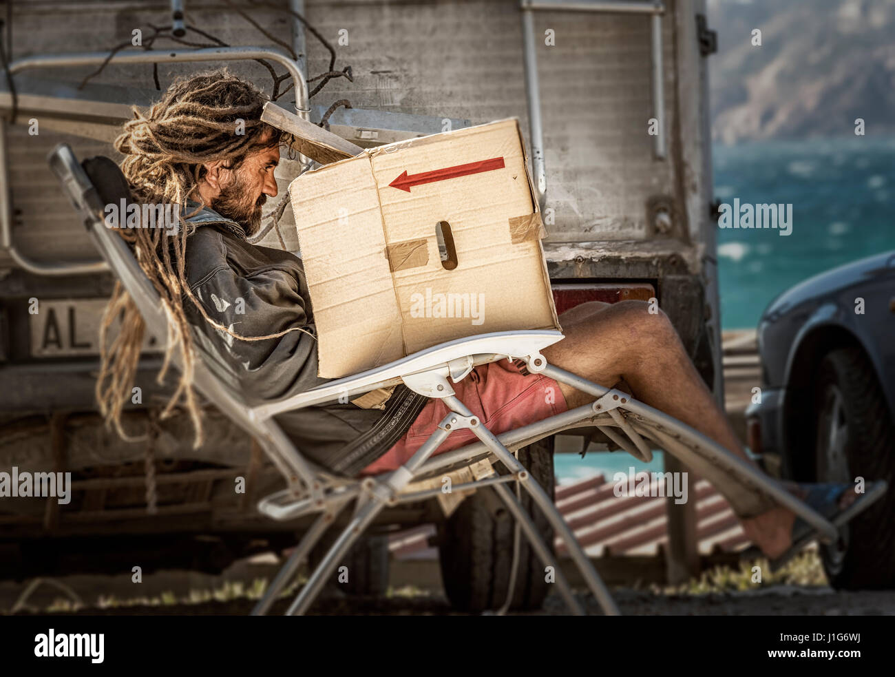 Rasta man working on his lap top. Banque D'Images