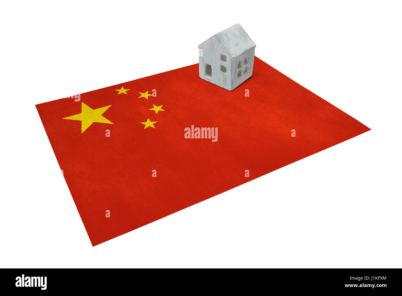 Petite maison sur un drapeau - vivant ou la migration vers la Chine Banque D'Images