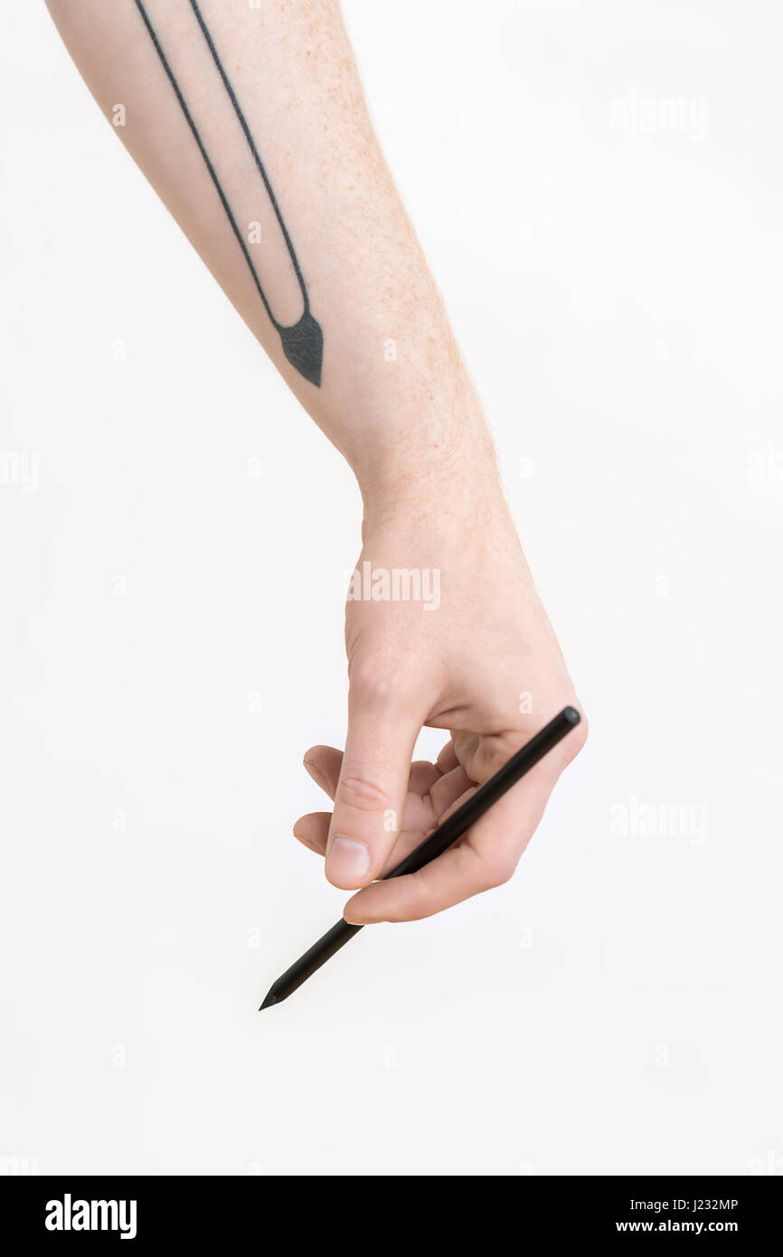 La main avec un crayon noir Banque D'Images