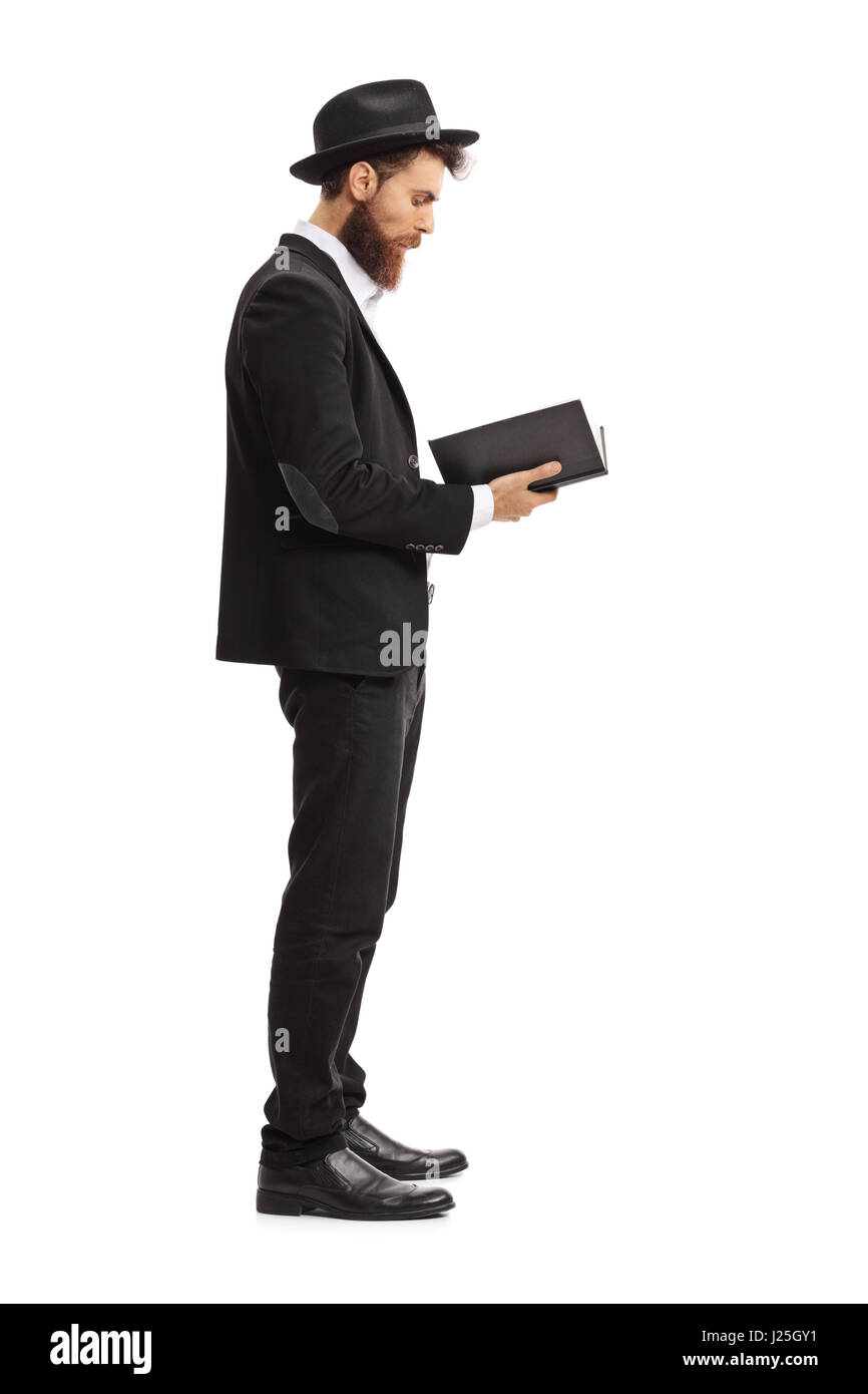 Profil de toute la longueur d'un homme religieux lire un livre isolé sur fond blanc Banque D'Images