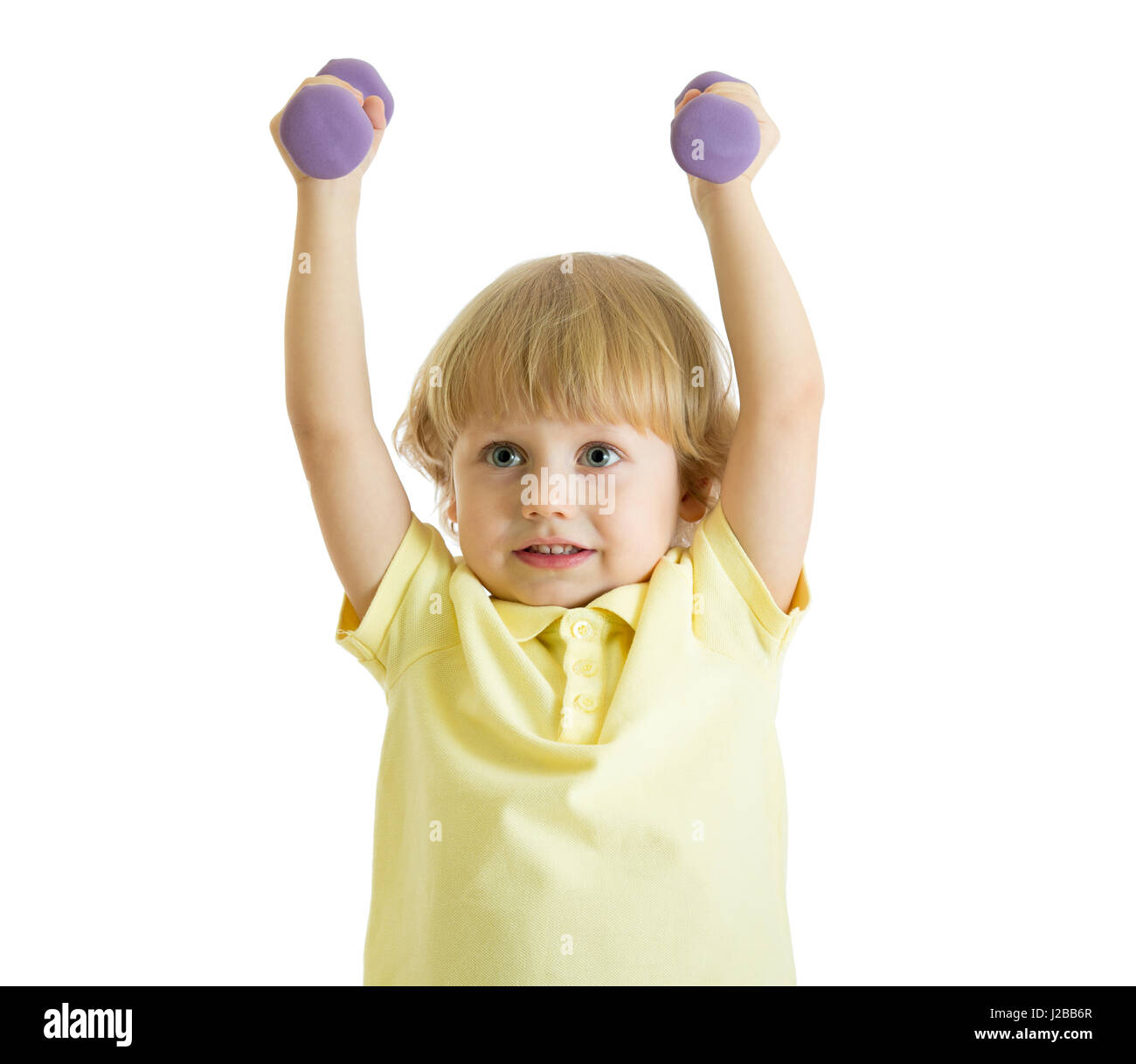 Enfant Garçon est en train de faire des exercices pour développer des muscles isolé sur fond blanc Banque D'Images