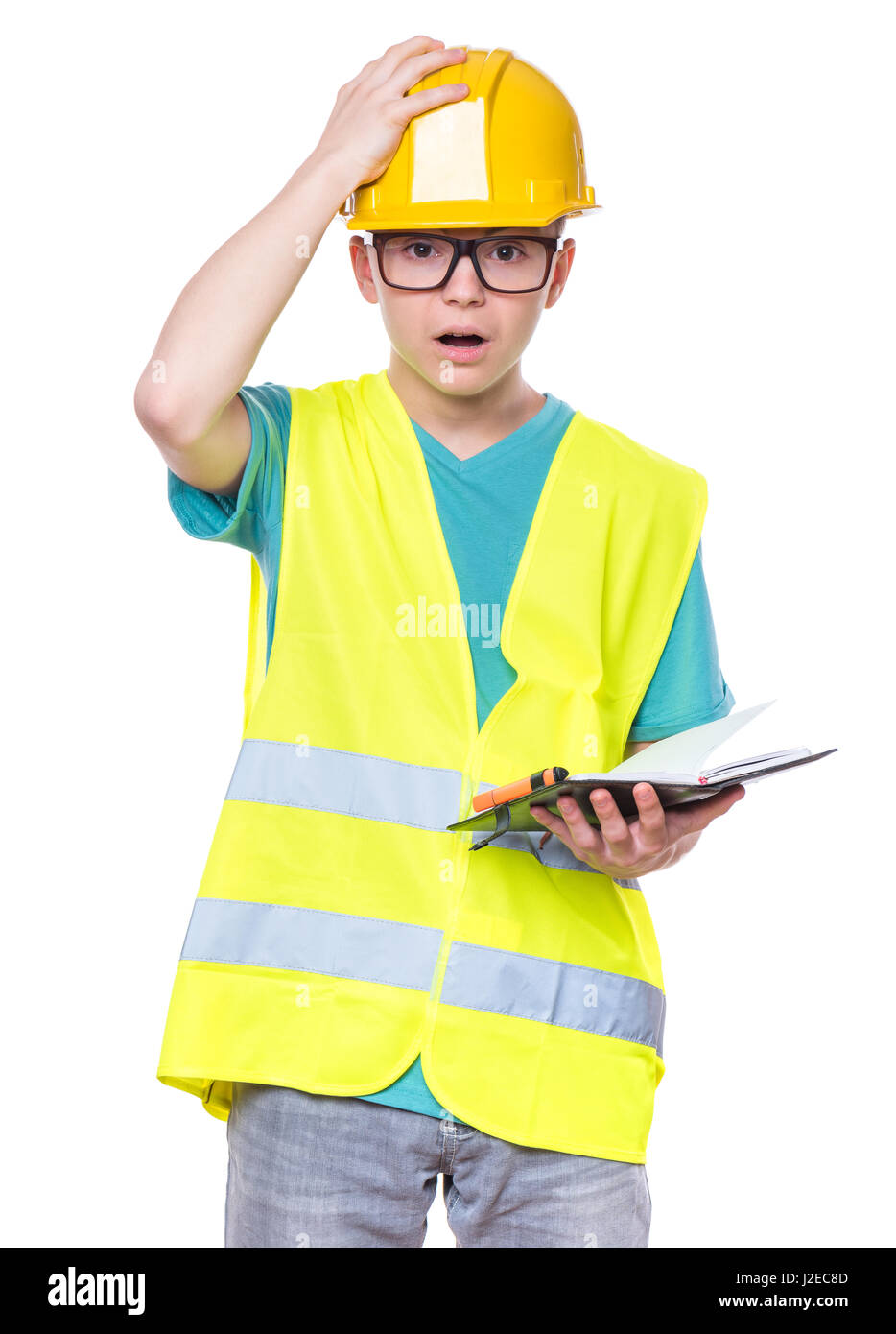 Boy wearing hard hat jaune Banque D'Images
