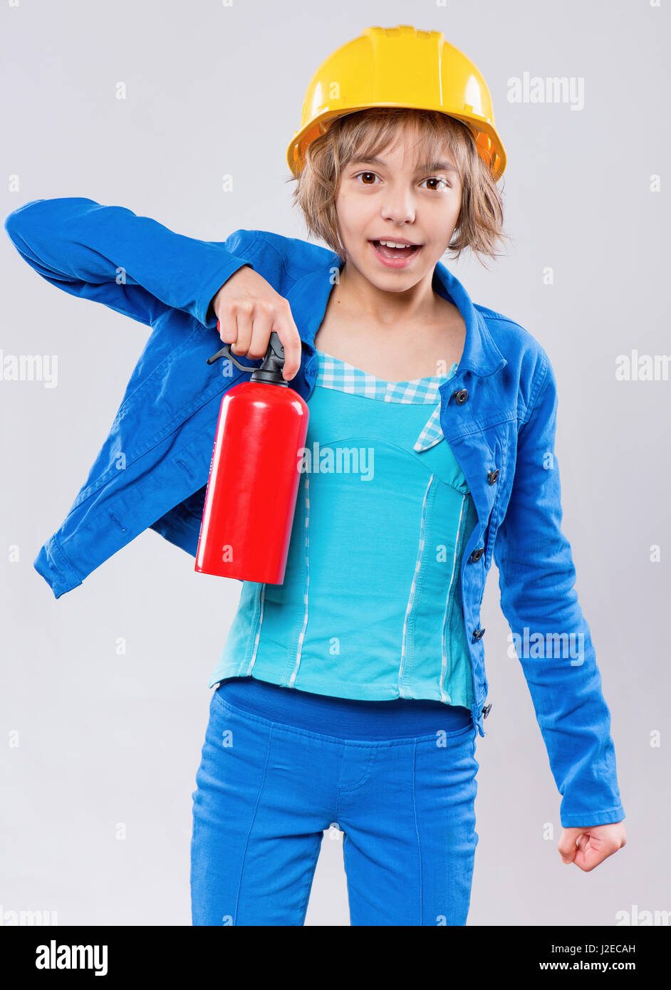 Girl wearing hard hat jaune Banque D'Images